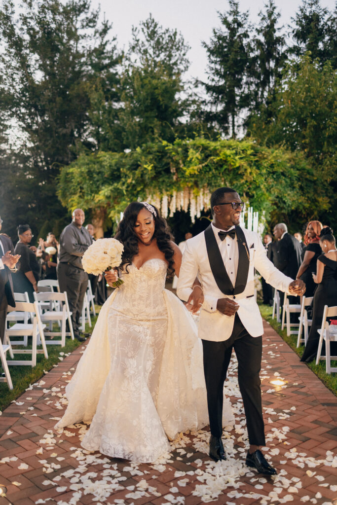 Arielle and Jamari's black-tie wedding affair featured romantic fashion with a dramatic flare and classic white and gold decor!