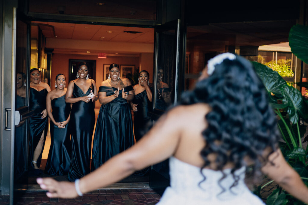 Arielle and Jamari's black-tie wedding affair featured romantic fashion with a dramatic flare and classic white and gold decor!