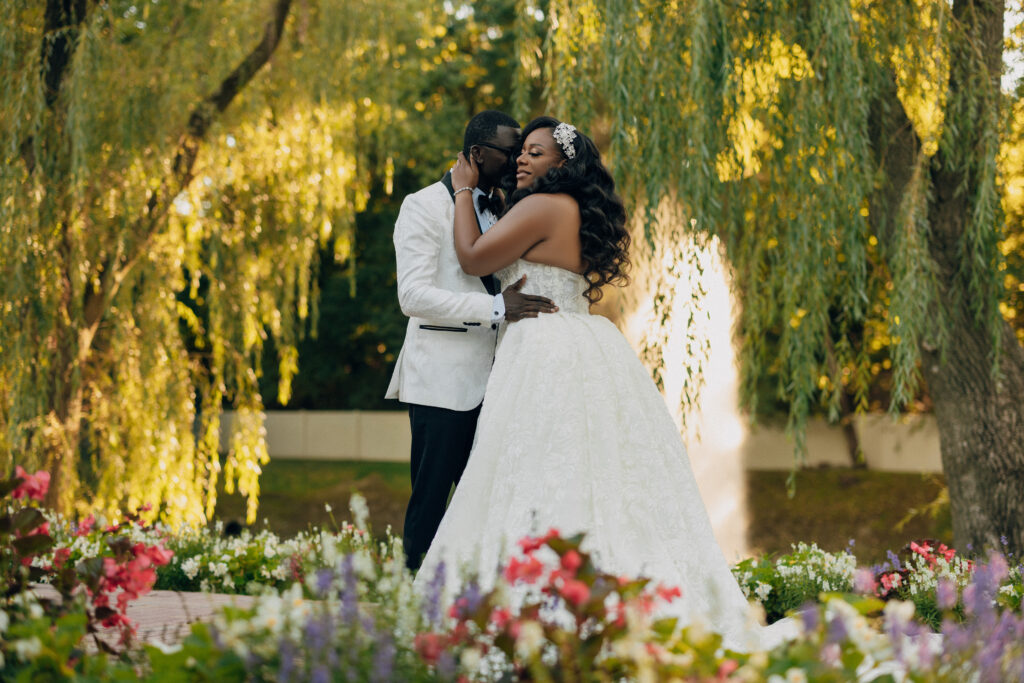 Arielle and Jamari's black-tie wedding affair featured romantic fashion with a dramatic flare and classic white and gold decor!