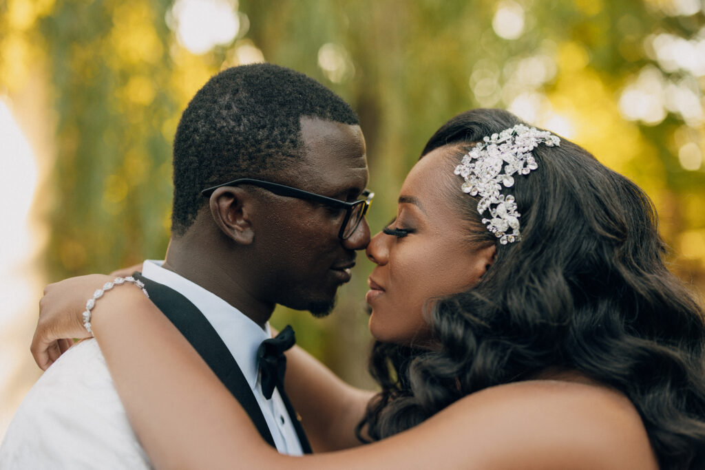 Arielle and Jamari's black-tie wedding affair featured romantic fashion with a dramatic flare and classic white and gold decor!