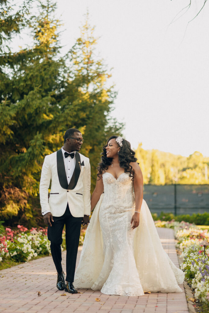 Arielle and Jamari's black-tie wedding affair featured romantic fashion with a dramatic flare and classic white and gold decor!