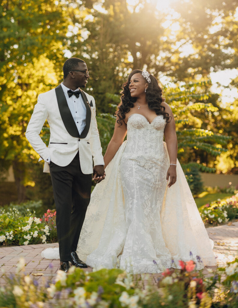 Arielle and Jamari's black-tie wedding affair featured romantic fashion with a dramatic flare and classic white and gold decor!