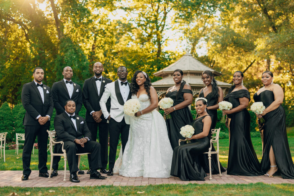 Arielle and Jamari's black-tie wedding affair featured romantic fashion with a dramatic flare and classic white and gold decor!