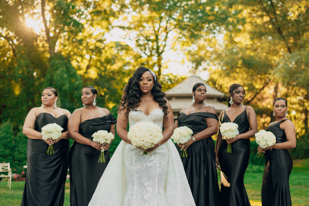 Arielle and Jamari's black-tie wedding affair featured romantic fashion with a dramatic flare and classic white and gold decor!