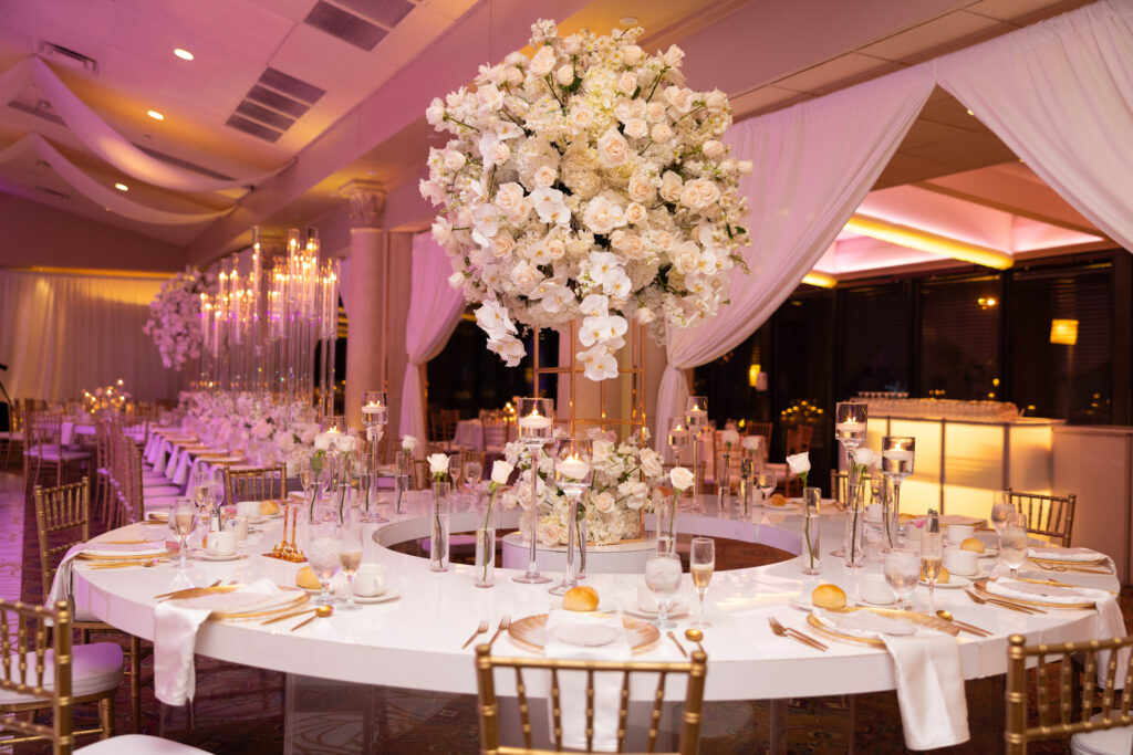 Arielle and Jamari's black-tie wedding affair featured romantic fashion with a dramatic flare and classic white and gold decor!