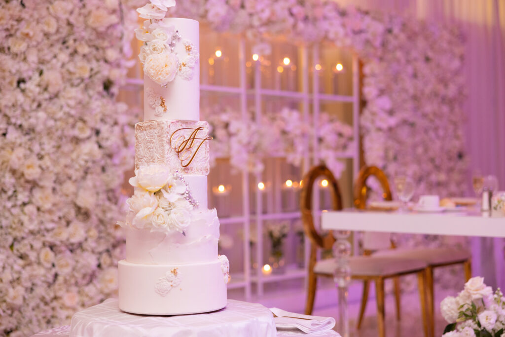 Arielle and Jamari's black-tie wedding affair featured romantic fashion with a dramatic flare and classic white and gold decor!