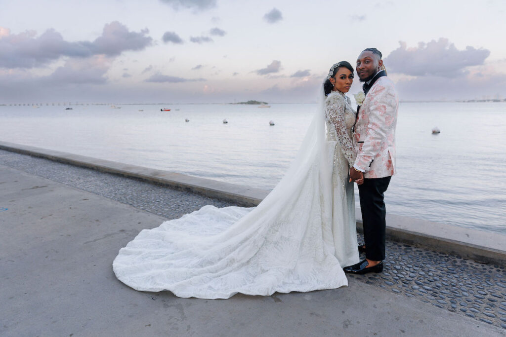 This luxury wedding at Briza on the Bay in Miami, Florida, features two glamorous outfits by the bride and groom and an intimate first look.