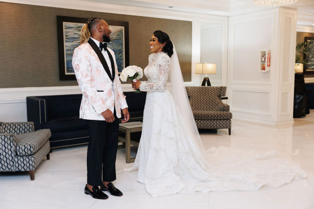 This luxury wedding at Briza on the Bay in Miami, Florida, features two glamorous outfits by the bride and groom and an intimate first look.