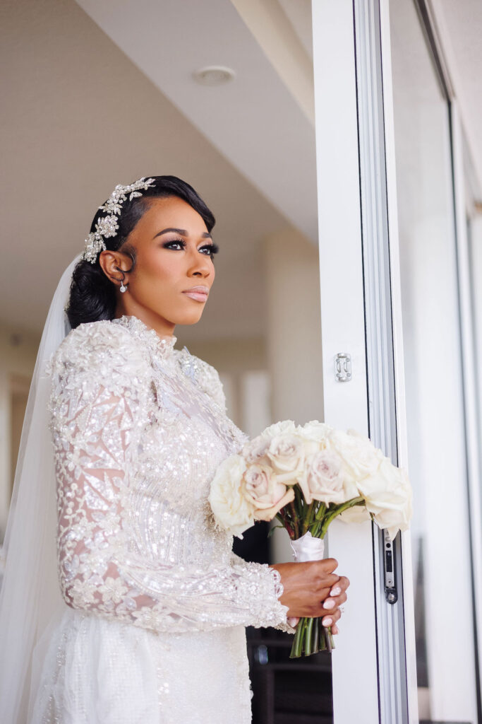 This luxury wedding at Briza on the Bay in Miami, Florida, features two glamorous outfits by the bride and groom and an intimate first look.