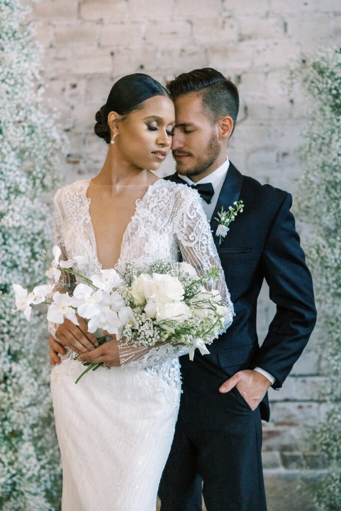 Featured in MunaLuchi Bridal Magazine Issue 29, Omaria McCrae creates and captures an intricate scene of classic ethereal romance at the historic Rialto Theatre in Tampa, Florida.