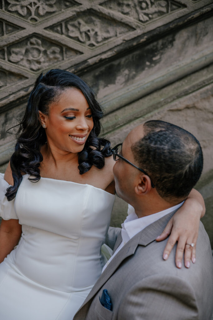 Morin and Caron's timeless spring e-session features elegant style, fully bloomed cherry blossoms, and the iconic scenery of Central Park!