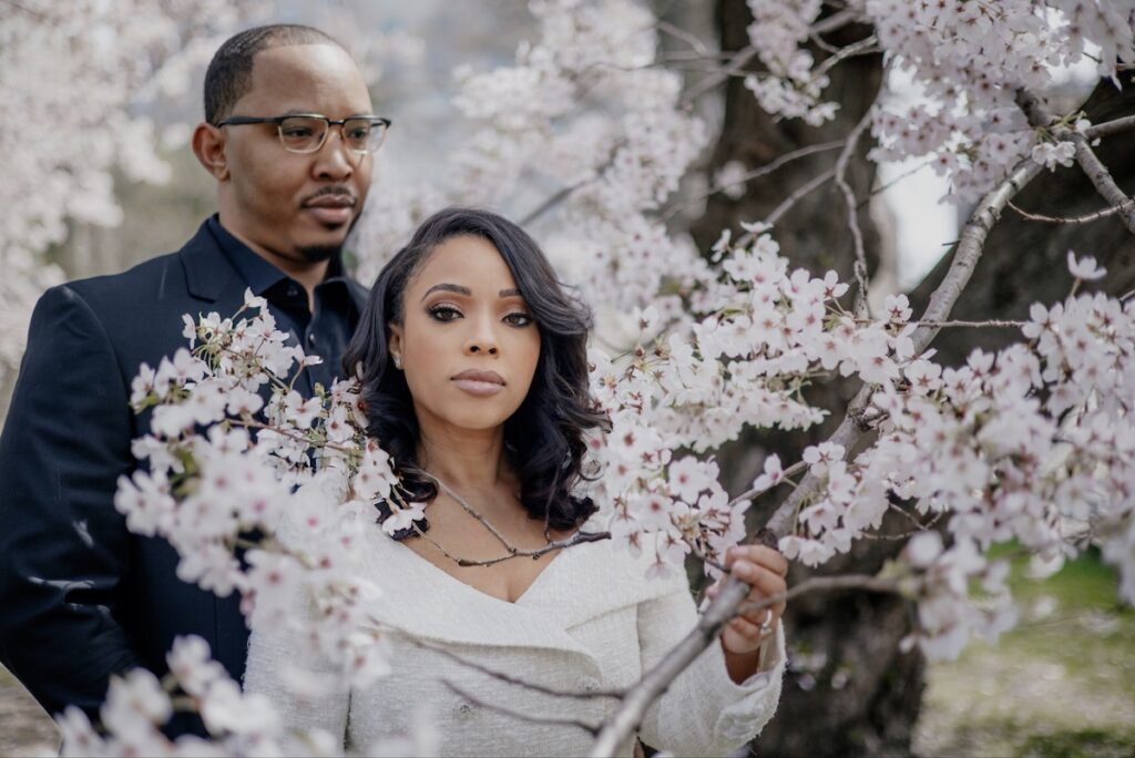 Morin and Caron's timeless spring e-session features elegant style, fully bloomed cherry blossoms, and the iconic scenery of Central Park!