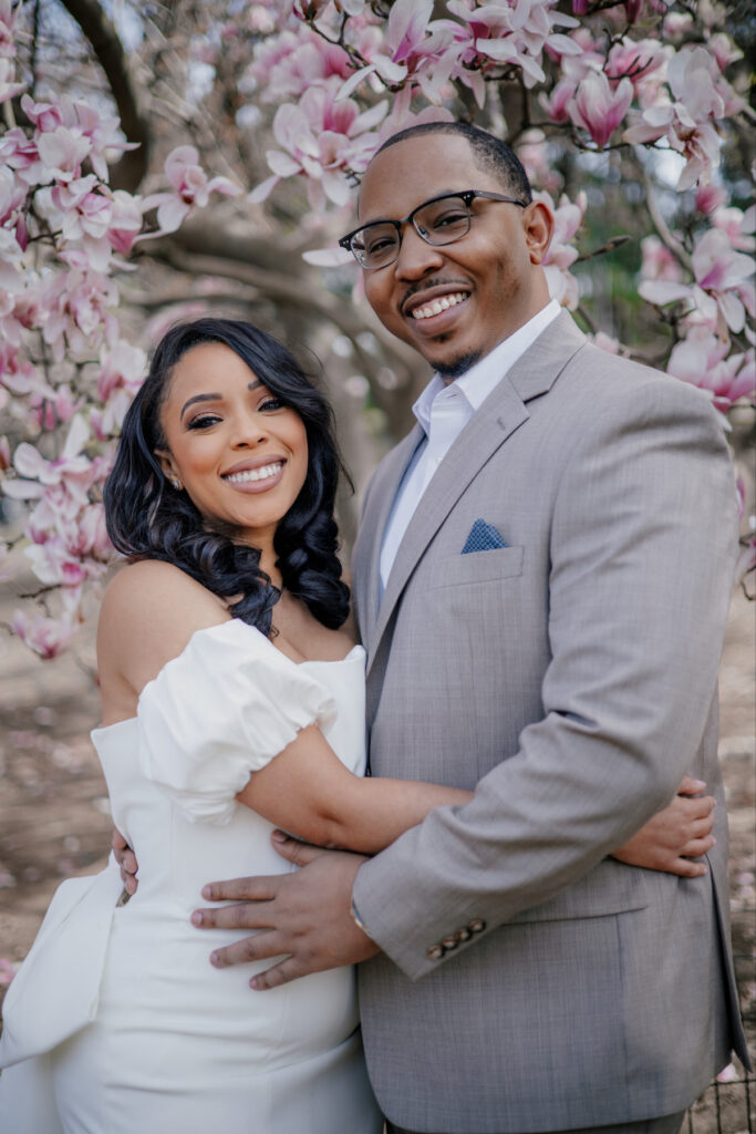 Morin and Caron's timeless spring e-session features elegant style, fully bloomed cherry blossoms, and the iconic scenery of Central Park!