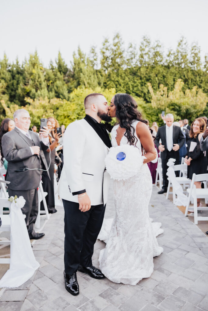 Olivia and Mauricio hosted an elegant and angelic wedding at Russo's on the Bay with a STUNNING Pantora Bridal gown and white tux by Garçon Couture.