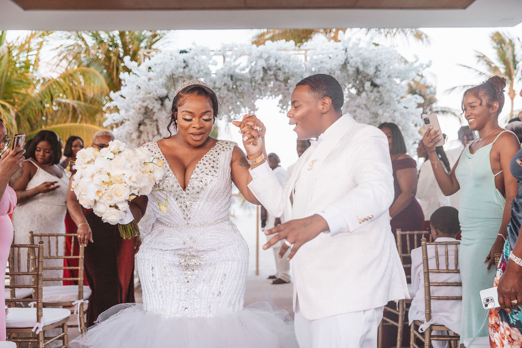 Beautiful brides say “I Do!” in a traditional and elegant destination wedding at the Finest Playa Mujeres in Mexico with lux florals & decor!