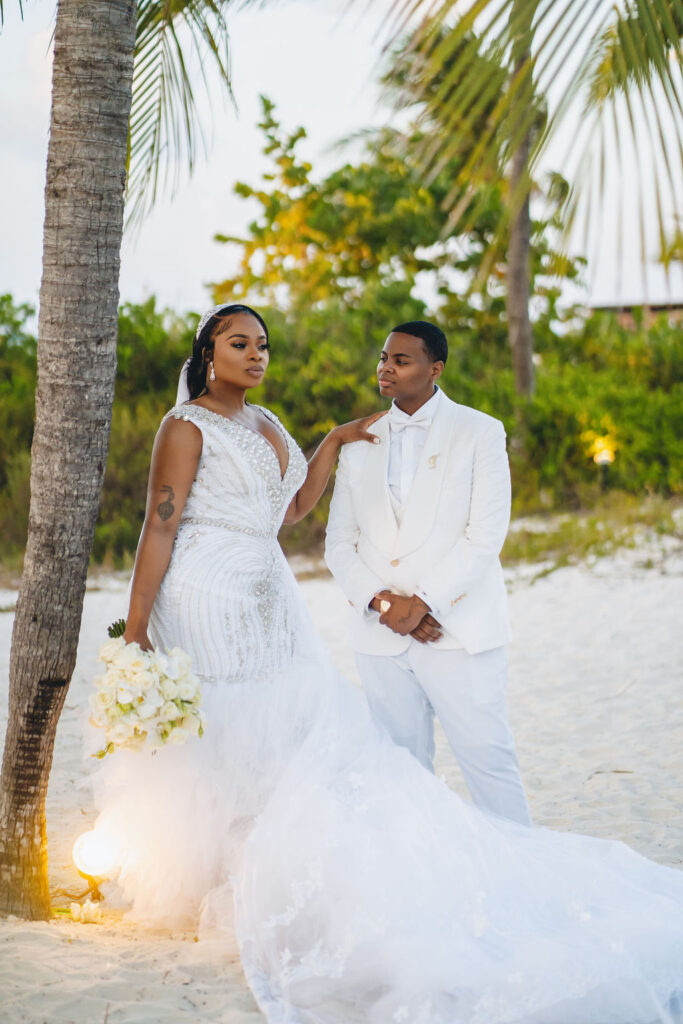 Beautiful brides say “I Do!” in a traditional and elegant destination wedding at the Finest Playa Mujeres in Mexico with lux florals & decor!