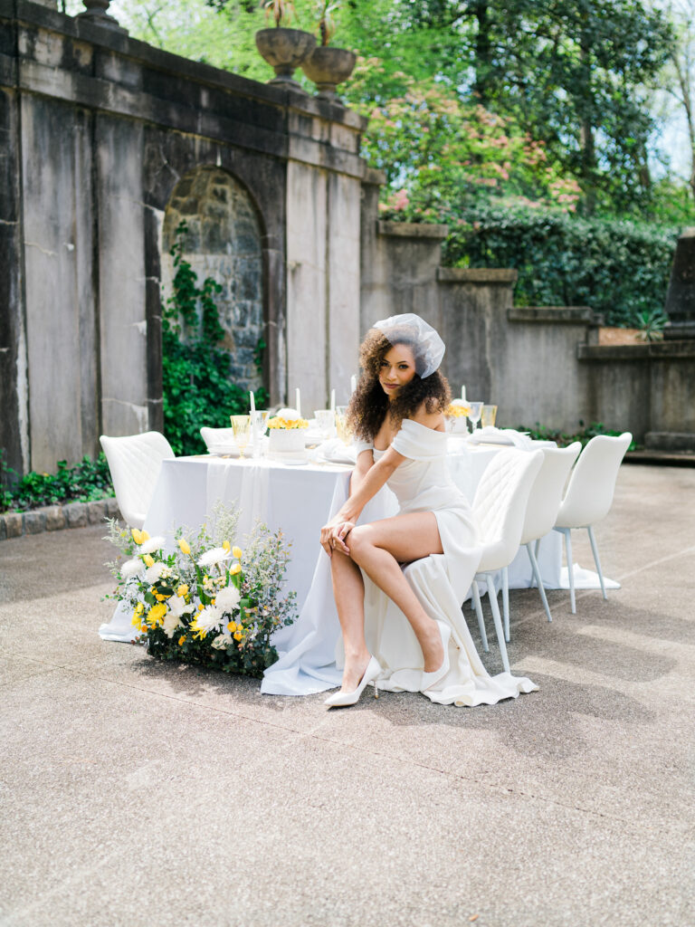 Inspired by the fresh feeling summer brings and the color yellow, this modern summer-styled shoot at the Swan House Atlanta History Center features a contemporary tablescape and decor with romantic touches and three fashion-forward bridal looks! 