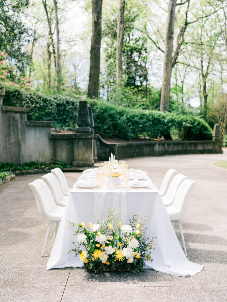 Inspired by the fresh feeling summer brings and the color yellow, this modern summer-styled shoot at the Swan House Atlanta History Center features a contemporary tablescape and decor with romantic touches and three fashion-forward bridal looks! 