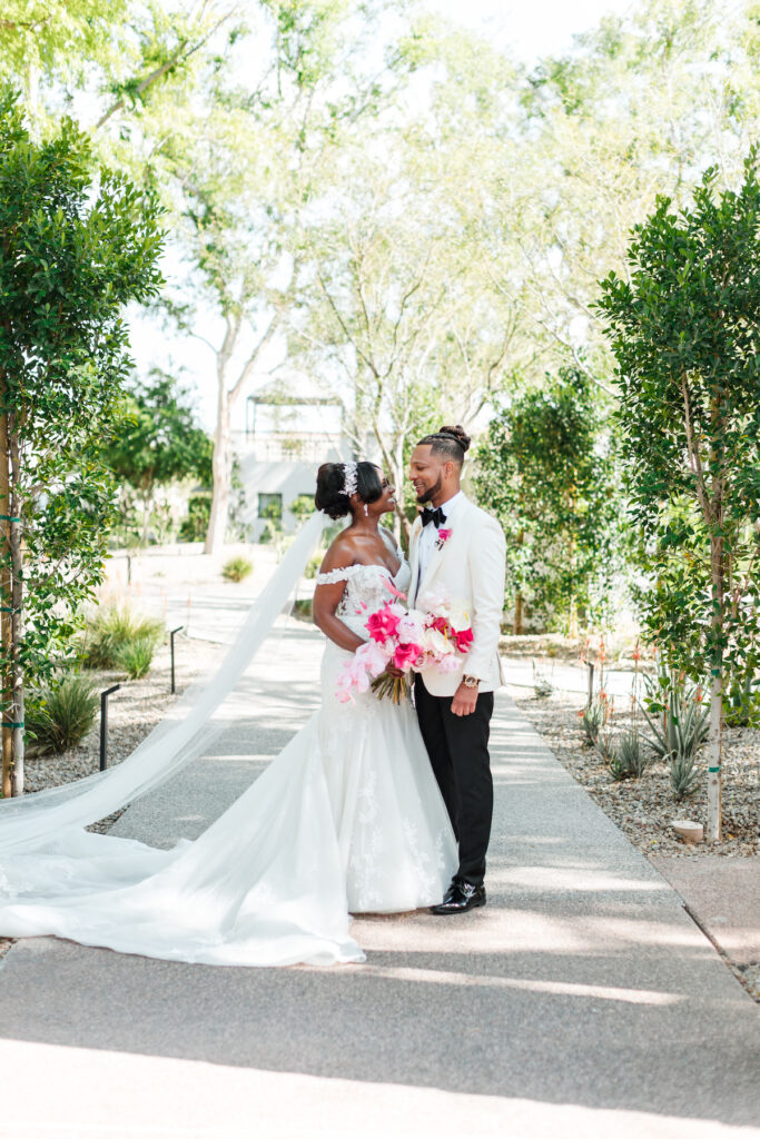 This outdoor wedding held at the beautiful Hyatt Regency Resort in Scottsdale, AZ, had timelessly chic details and perfectly pink surprises.