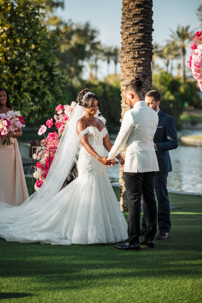 This outdoor wedding held at the beautiful Hyatt Regency Resort in Scottsdale, AZ, had timelessly chic details and perfectly pink surprises.