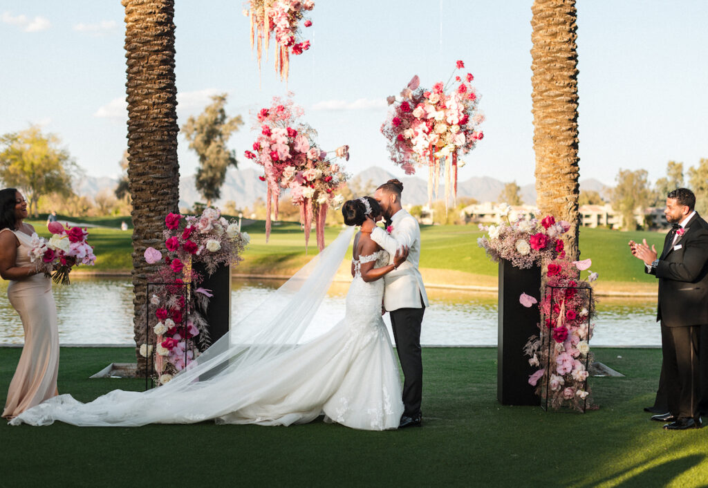 This outdoor wedding held at the beautiful Hyatt Regency Resort in Scottsdale, AZ, had timelessly chic details and perfectly pink surprises.