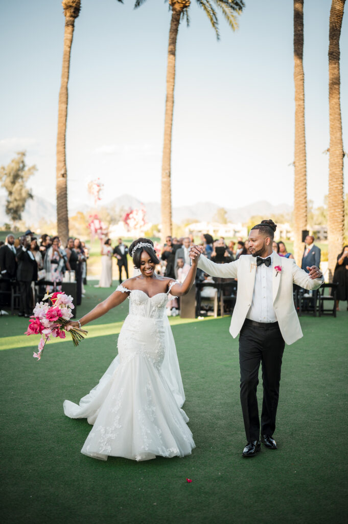 This outdoor wedding held at the beautiful Hyatt Regency Resort in Scottsdale, AZ, had timelessly chic details and perfectly pink surprises.