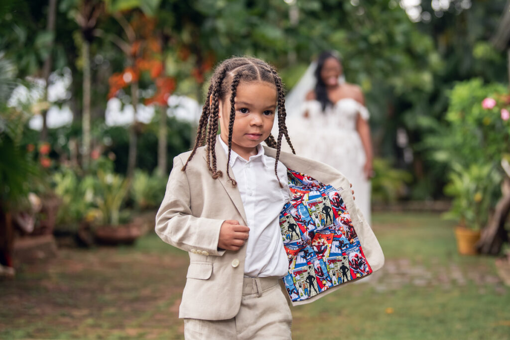 Glam destination wedding at The Wharf House in Montego Bay, Jamaica, features adorable wedding children and sweet island vibes.