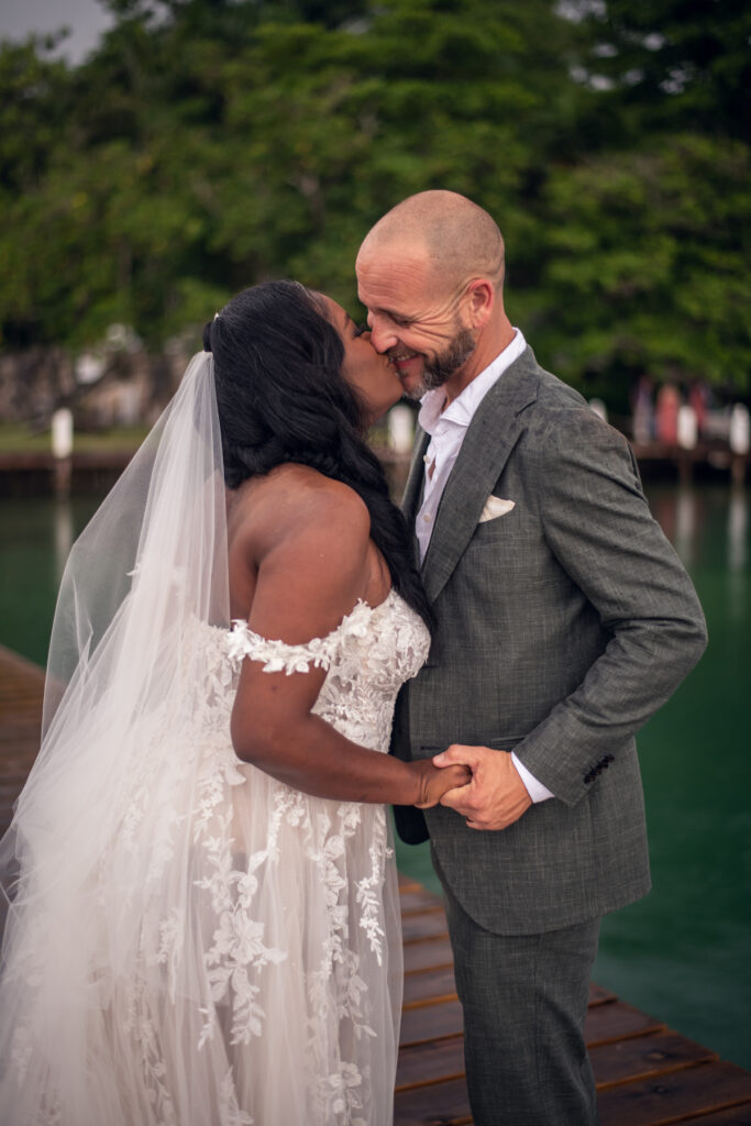 Glam destination wedding at The Wharf House in Montego Bay, Jamaica, features adorable wedding children and sweet island vibes.