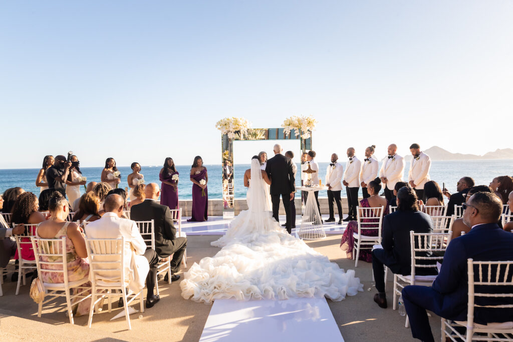 Tristian and Harold’s luxurious destination wedding in Cabo featured top-notch entertainment, glamorous custom fashion, and stunning views!