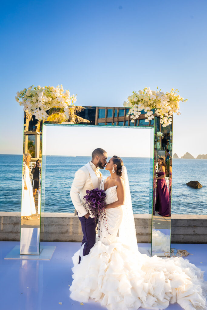 Tristian and Harold’s luxurious destination wedding in Cabo featured top-notch entertainment, glamorous custom fashion, and stunning views!