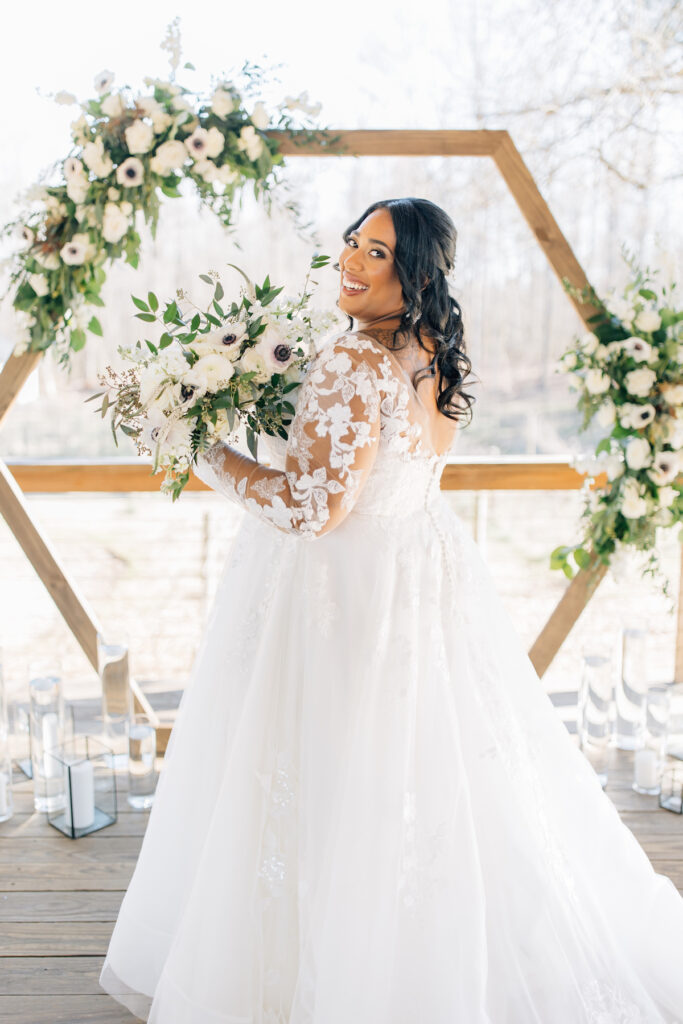 This wedding at Koury Farms in Georgia is perfect for the edgy boho bride with white flowers, greenery, and elevated gold accents.