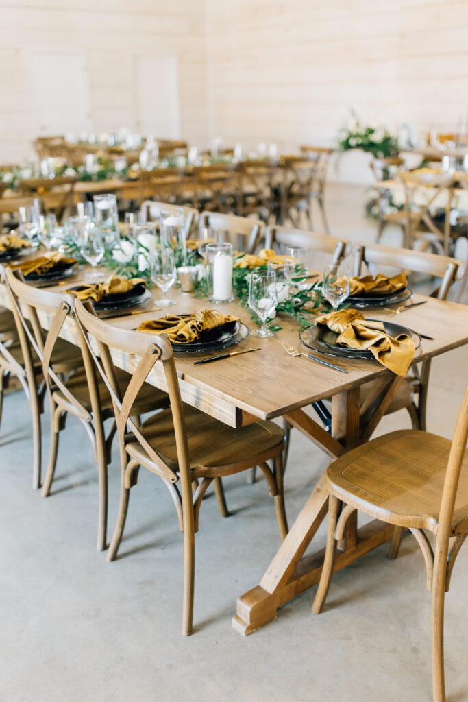 This wedding at Koury Farms in Georgia is perfect for the edgy boho bride with white flowers, greenery, and elevated gold accents.