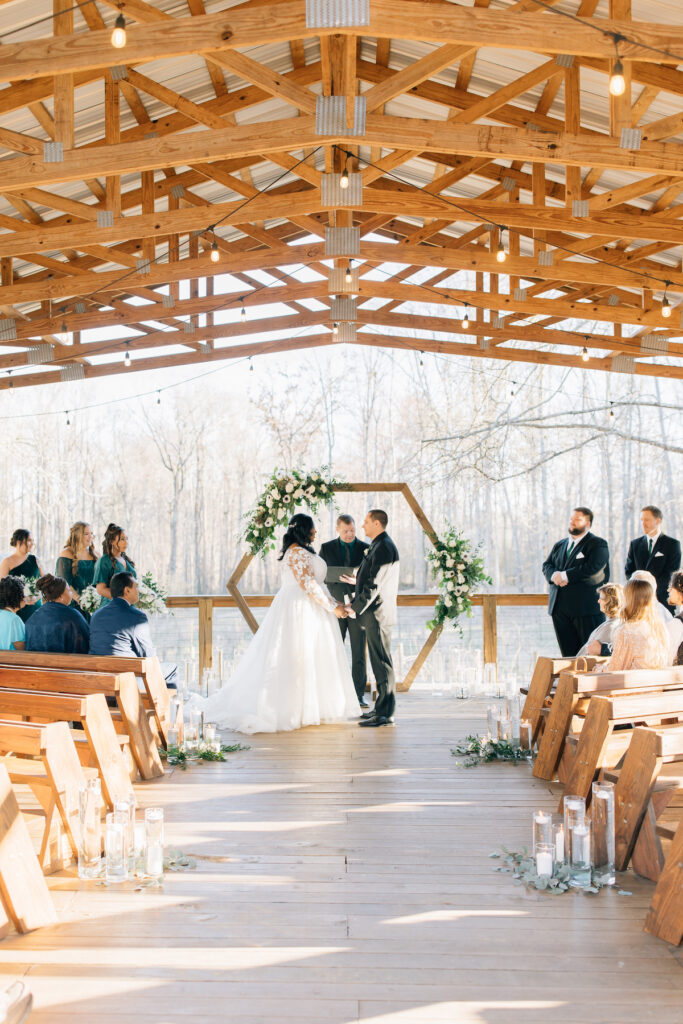 This wedding at Koury Farms in Georgia is perfect for the edgy boho bride with white flowers, greenery, and elevated gold accents.