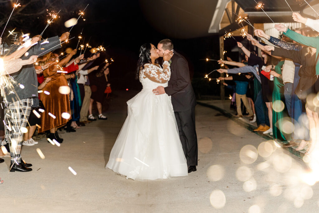 This wedding at Koury Farms in Georgia is perfect for the edgy boho bride with white flowers, greenery, and elevated gold accents.