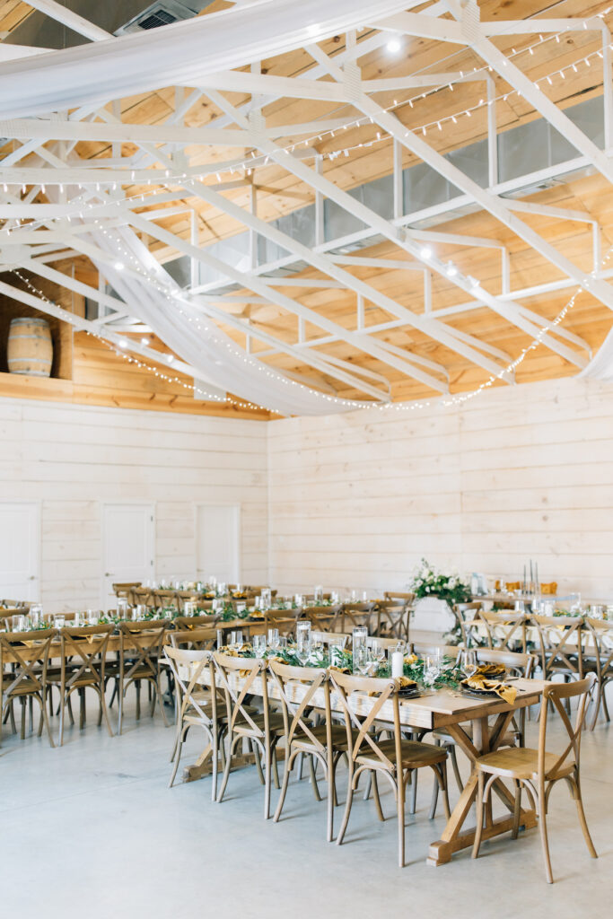 This wedding at Koury Farms in Georgia is perfect for the edgy boho bride with white flowers, greenery, and elevated gold accents.