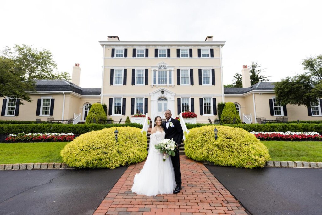 Haley and Jordan's elegant wedding at the Pen Ryn Mansion features lush greenery, personal details, and Jamaican cultural elements.