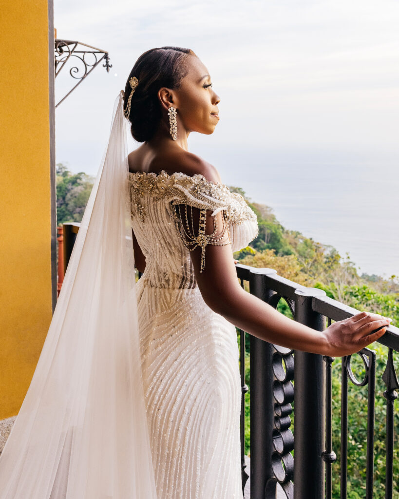 This luxe wedding in paradise featured vibrant details, stunning views, and the most romantic wedding dress by Ese Azenabor.