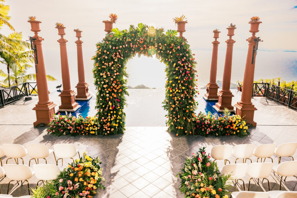 This luxe wedding in paradise featured vibrant details, stunning views, and the most romantic wedding dress by Ese Azenabor.