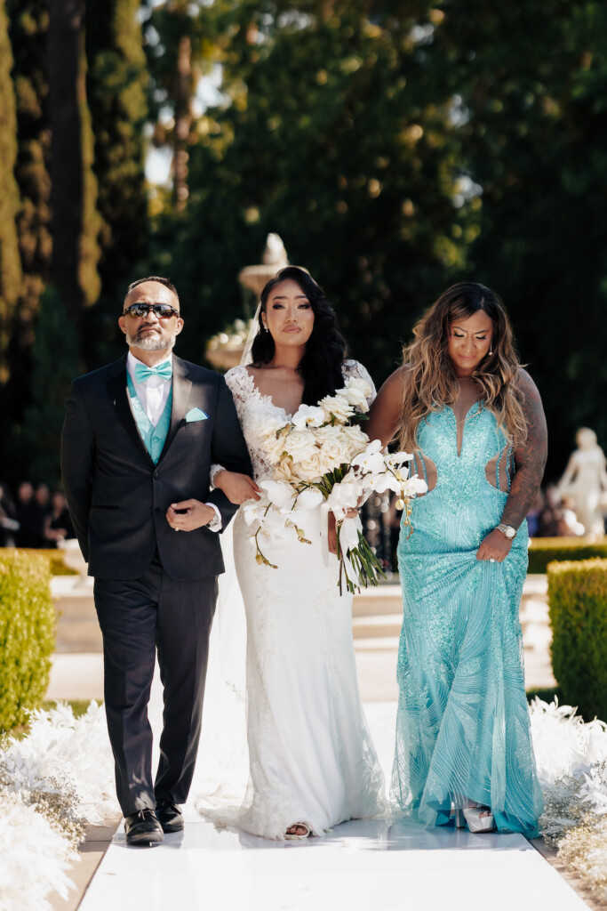 Featured in MunaLuchi Bride Magazine, Issue 31, Ray and Sidtia's two-day wedding in California celebrates Cambodian culture with gorgeous cultural attire, colorful floral designs, and a stunning all-white wedding.