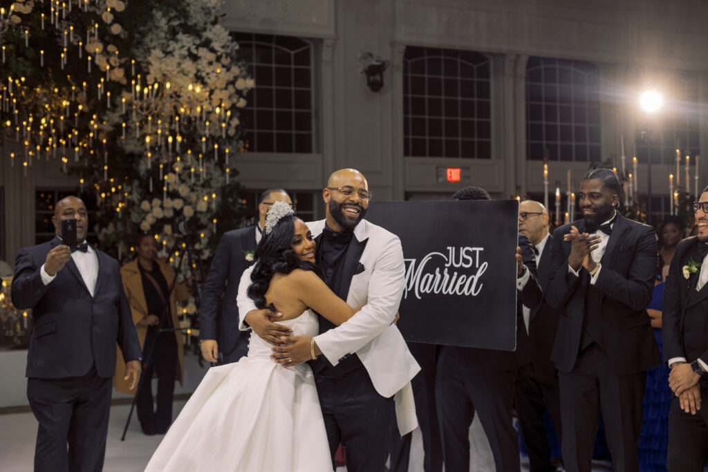 In this luxe ballroom wedding, fairytale details caught our eyes with romantic roses, tiaras, candles, and sparkly gowns.