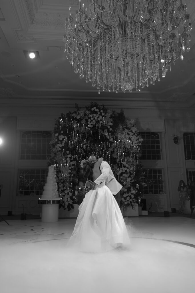 In this luxe ballroom wedding, fairytale details caught our eyes with romantic roses, tiaras, candles, and sparkly gowns.