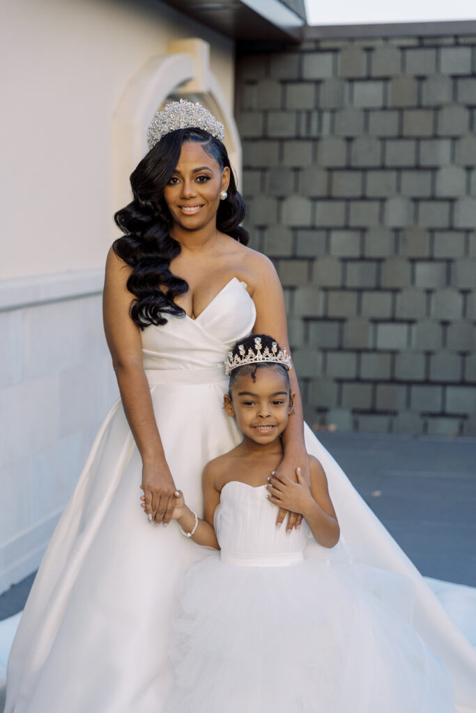 In this luxe ballroom wedding, fairytale details caught our eyes with romantic roses, tiaras, candles, and sparkly gowns.