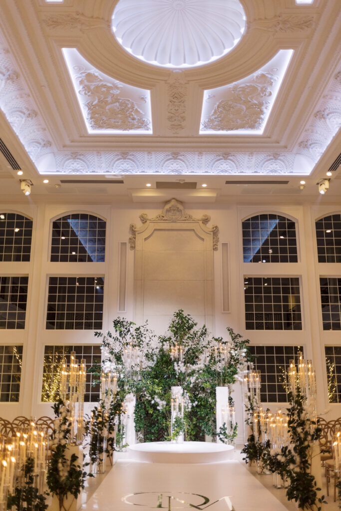 In this luxe ballroom wedding, fairytale details caught our eyes with romantic roses, tiaras, candles, and sparkly gowns.