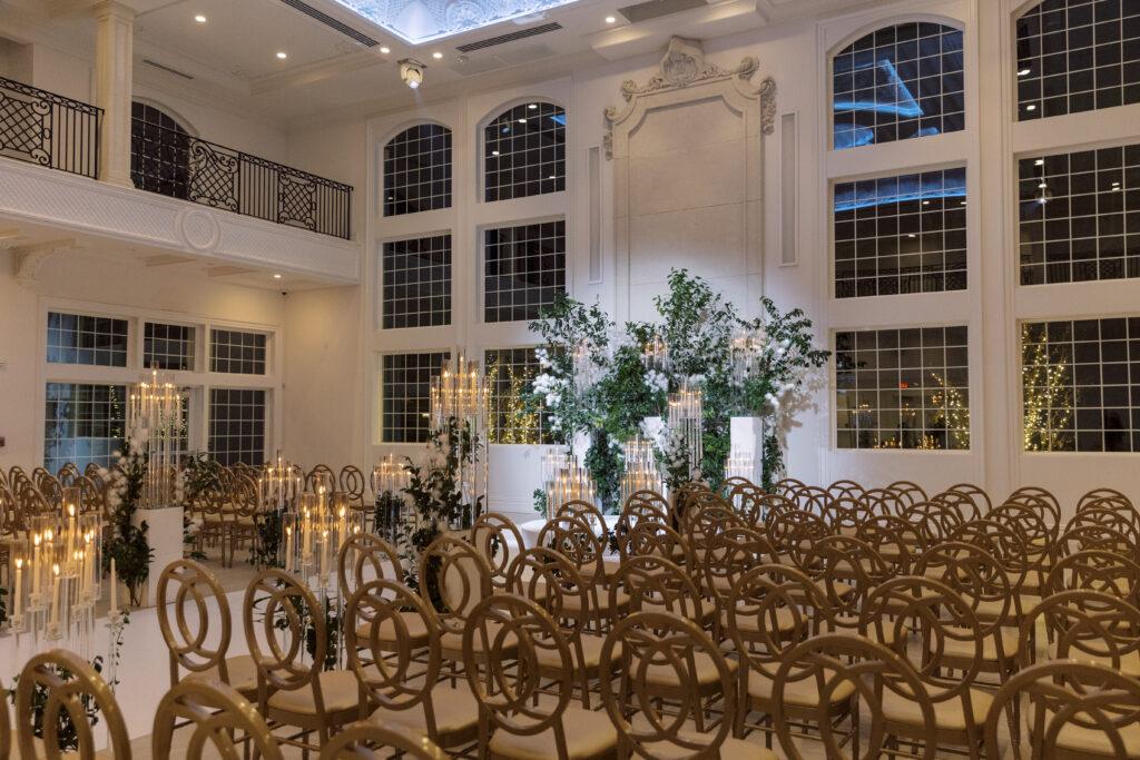 In this luxe ballroom wedding, fairytale details caught our eyes with romantic roses, tiaras, candles, and sparkly gowns.