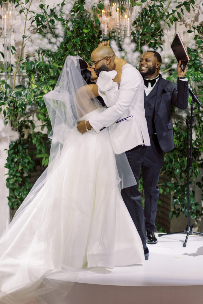 In this luxe ballroom wedding, fairytale details caught our eyes with romantic roses, tiaras, candles, and sparkly gowns.