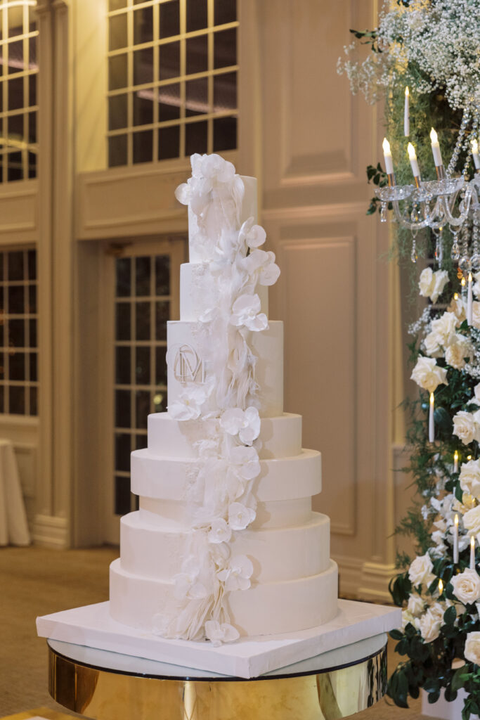 In this luxe ballroom wedding, fairytale details caught our eyes with romantic roses, tiaras, candles, and sparkly gowns.