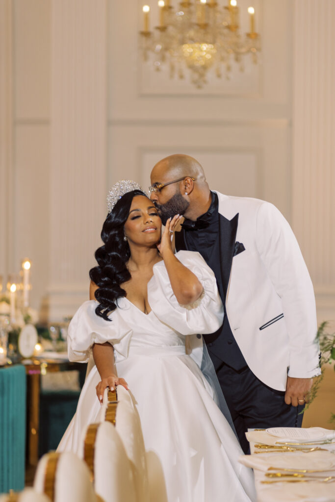 In this luxe ballroom wedding, fairytale details caught our eyes with romantic roses, tiaras, candles, and sparkly gowns.