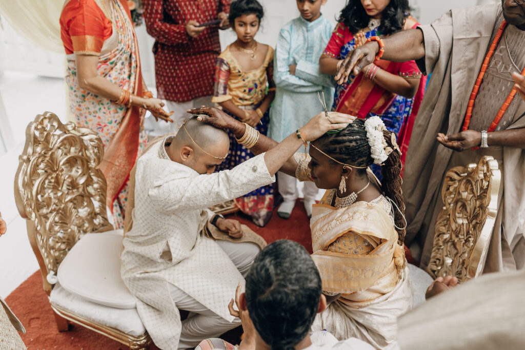 Bunmi and Kiran wed at their vibrant multicultural wedding which beautifully blended traditional Hindu and Nigerian wedding customs!