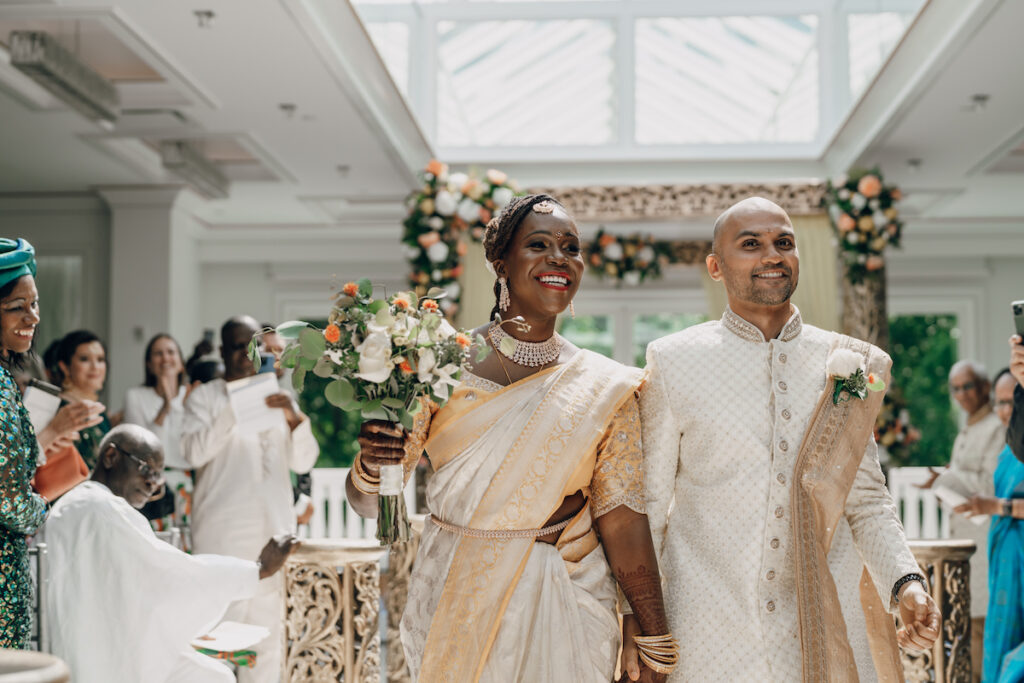 Bunmi and Kiran wed at their vibrant multicultural wedding which beautifully blended traditional Hindu and Nigerian wedding customs!