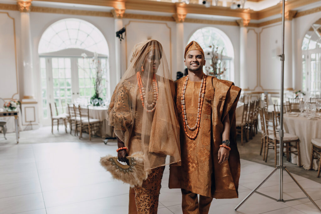 Bunmi and Kiran wed at their vibrant multicultural wedding which beautifully blended traditional Hindu and Nigerian wedding customs!